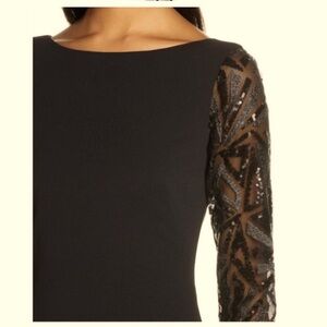 Long sleeved Vince Camuto gown. Fishtail fit, long sleeves with sequin detail.